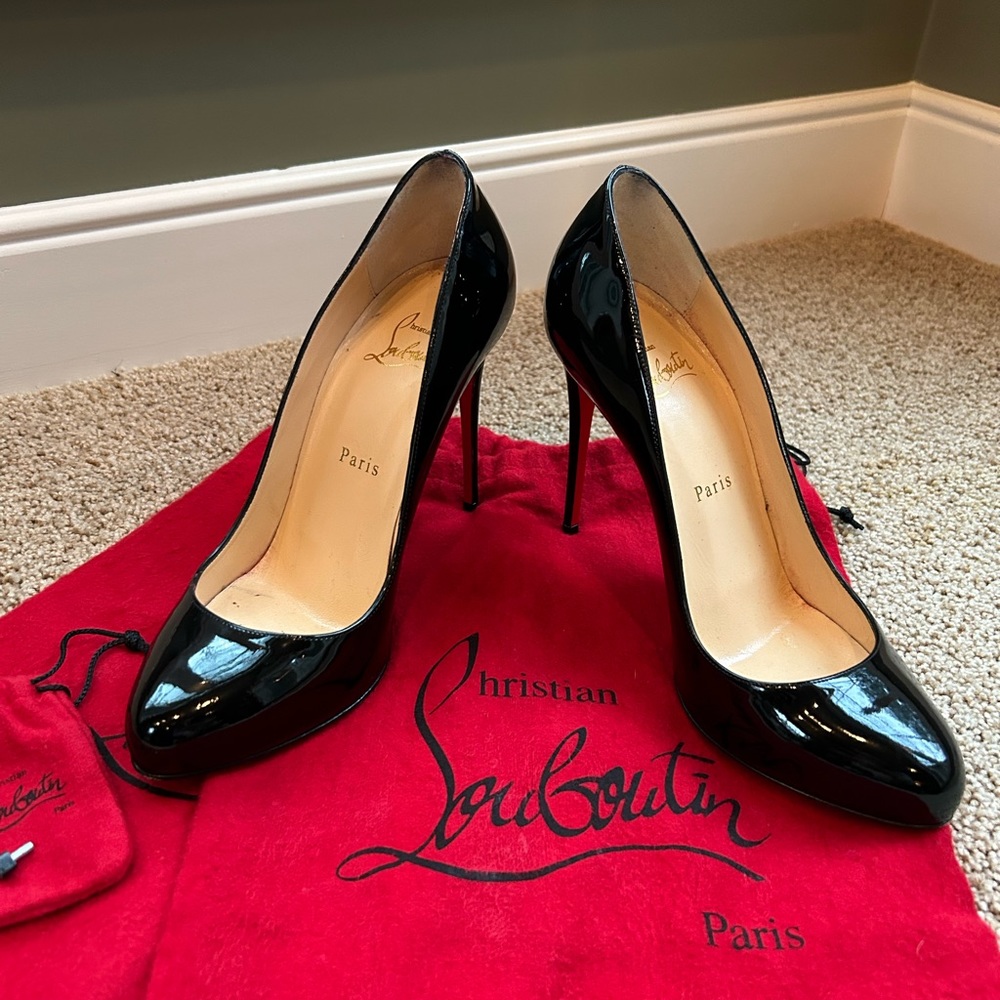 Christian Louboutin black patent leather EU size 38 (US 7.5).  4” heels
